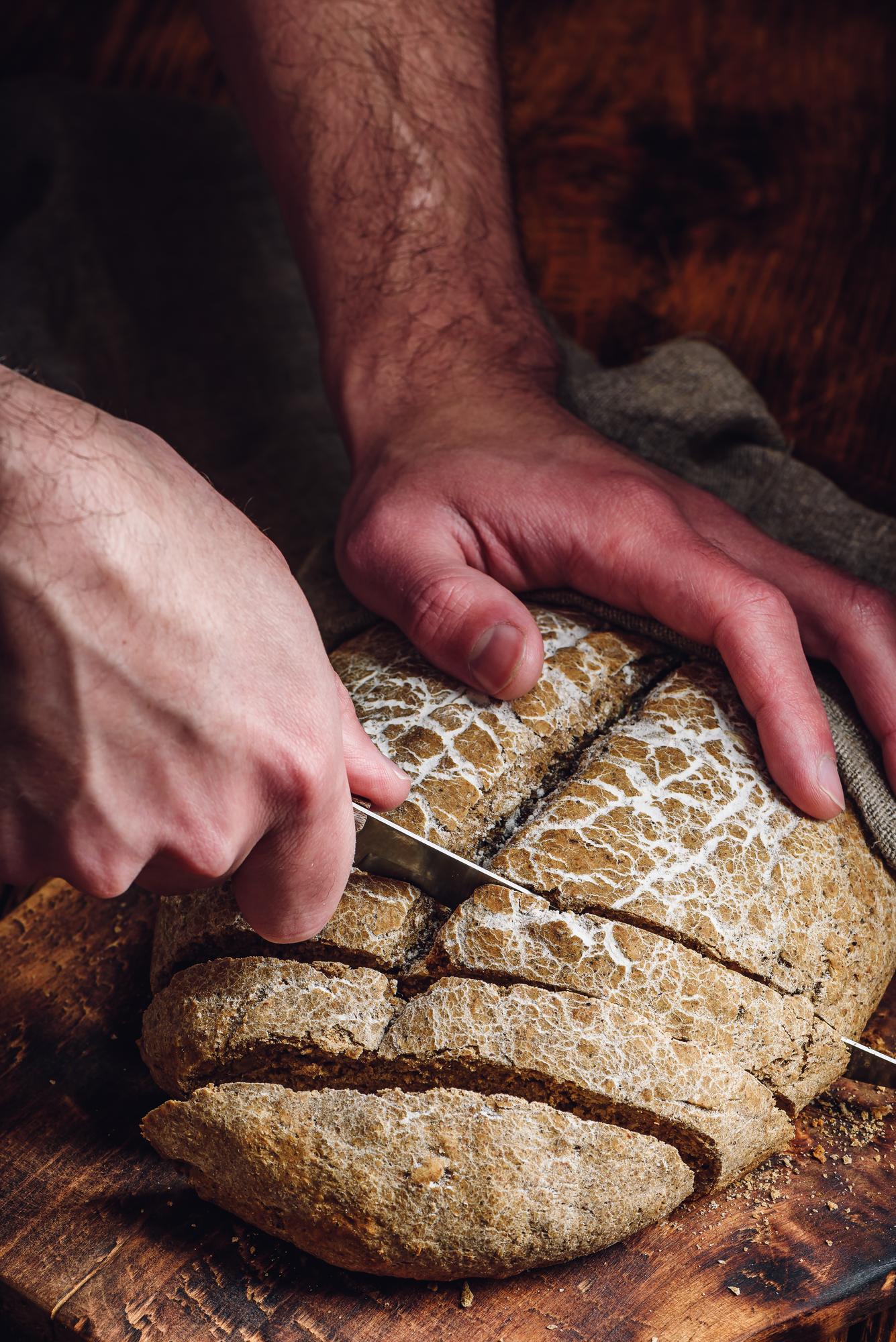 Closeup artisanal bread making process hands